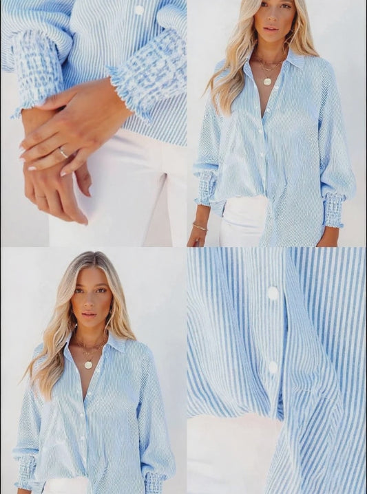 This Week's Special Price $24.99 Mid-length shirt with striped lapel and oversized drawdown sleeves